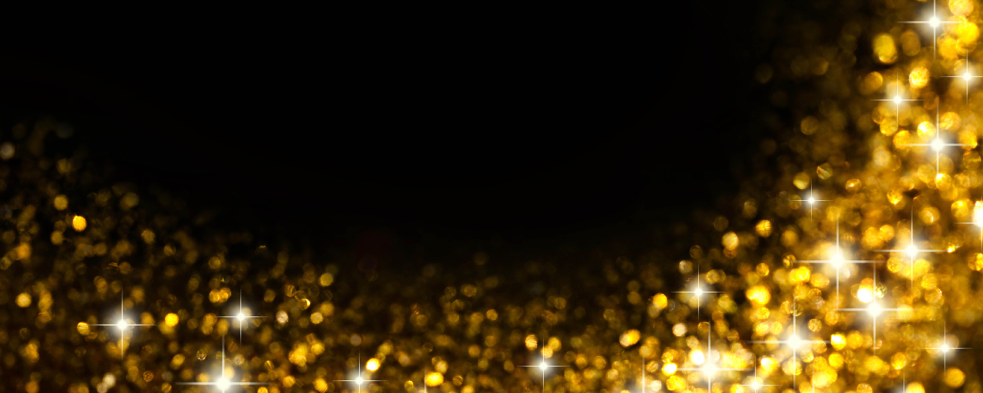 Sparkling gold glitter confetti on a black background